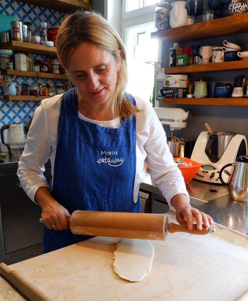 rolling out the dough for the pierogi