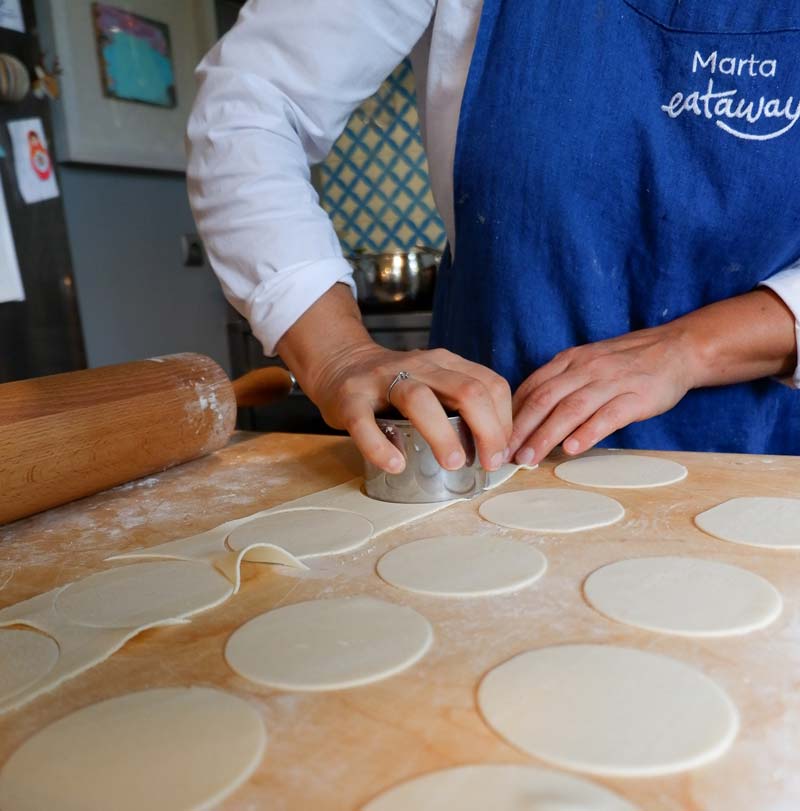 cutting out the pierogi dough